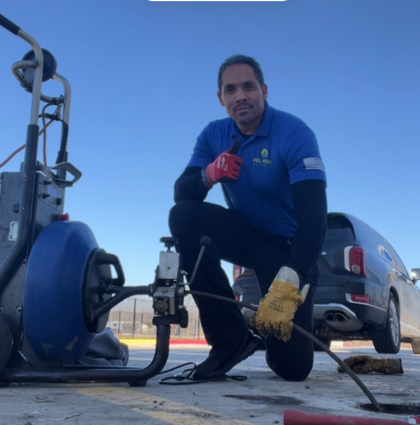 Full Force Plumbing technician performing drain cleaning service