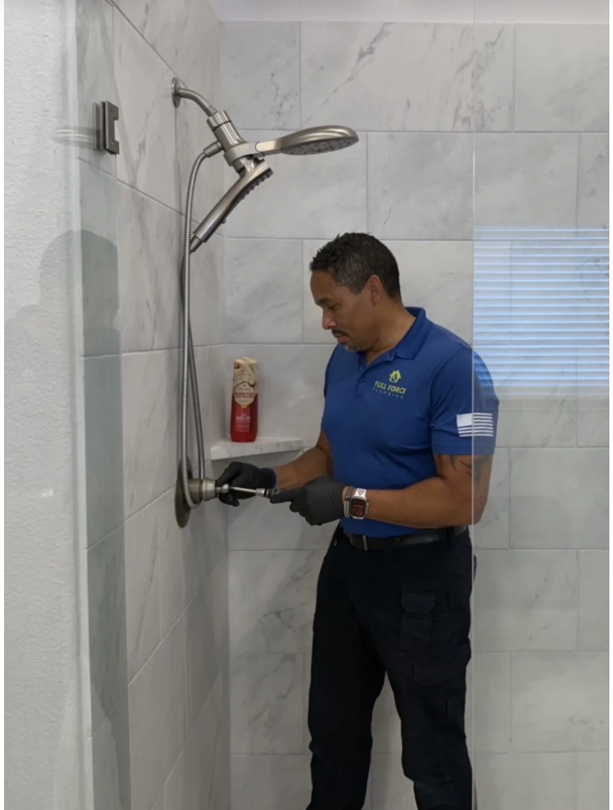 Full Force Plumbing technician servicing a shower fixture